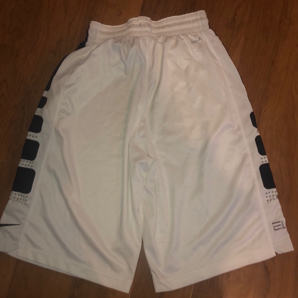 two pairs of nike elite white shorts